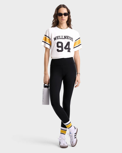 Sporty & Rich Wellness 94 Rugby Tee - White/Faded Gold/Faded Black